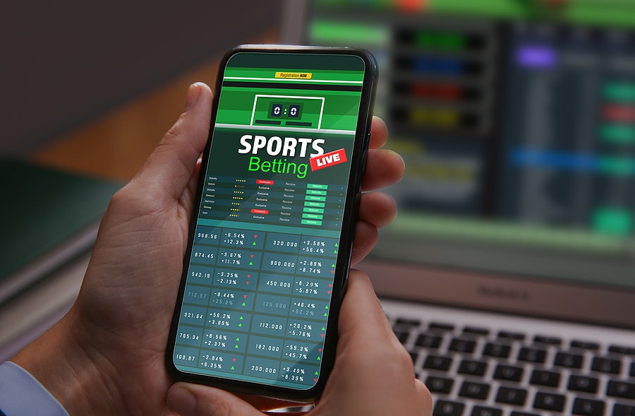 Person using a sports betting app on a smartphone